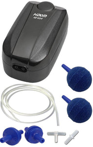 a glossy black twin outlet aquarium air pump with an adjustable dial and a selection of accessories