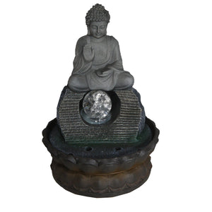 indoor water feature with a buddha sitting on top