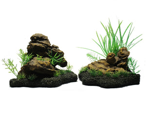 2 separate aquarium rock features with small grasses growing in and around the rocks
