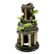 Tall roman tower structure surrounded by white pillars and outcrops of small green plants